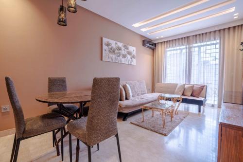 Ruang duduk di Studio Cosy avec Piscine et Terrasse