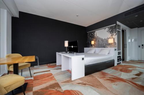 Postel nebo postele na pokoji v ubytování Fletcher Wellness-Hotel Helmond
