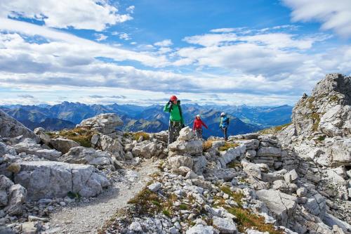 a group of people standing on the top of a mountain at Explorer Hotel Kitzbühel in Sankt Johann in Tirol