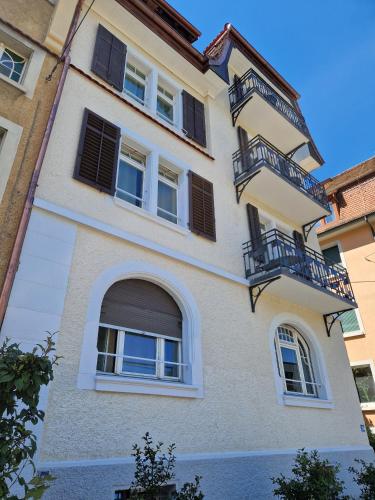 a building with windows and balconies on it at HITrental Riesbach Apartments in Zürich