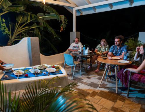 a group of people sitting at tables on a patio at La Casa Sorento in Victoria
