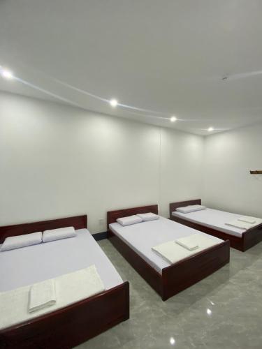 Ένα ή περισσότερα κρεβάτια σε δωμάτιο στο Hà Tiên Hạnh Phúc 3