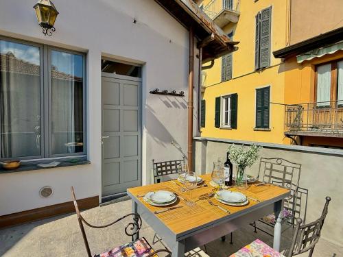 a table and chairs sitting on a patio at Casbah, suites nel cuore di Menaggio in Menaggio