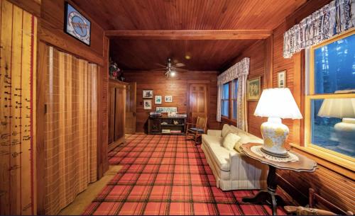 a living room with a couch and a table at The Pines of Three Lakes in Eagle River