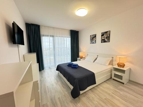 a bedroom with a bed and a television in it at Ava Towers Accommodation 1-2 Bdm by GAP with Parking in Suceava