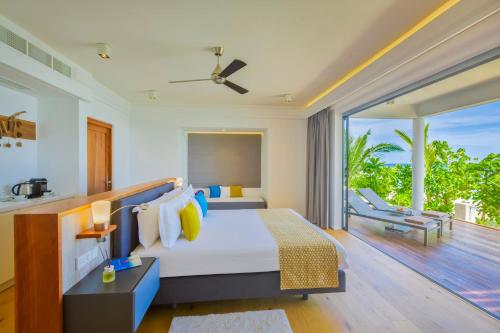 Letto o letti in una camera di Kuramathi Maldives