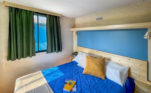 Letto o letti in una camera di Sereno Camping Holiday
