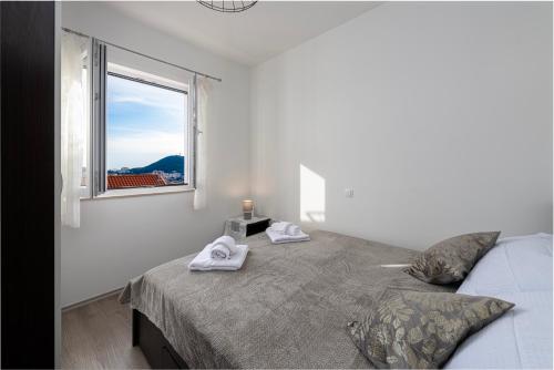Postel nebo postele na pokoji v ubytování Lumari Dubrovnik Apartment