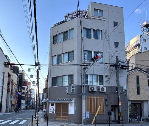 a tall building on a city street at Villa ayasuki Osaka namba in Osaka