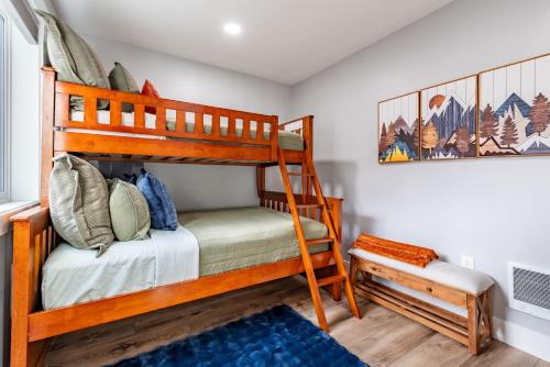 a bedroom with two bunk beds and a blue rug at Spacious 3BR Home Sleeps 8 Private Backyard in Everett