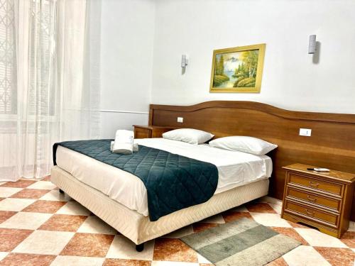 Postel nebo postele na pokoji v ubytování GranRoma
