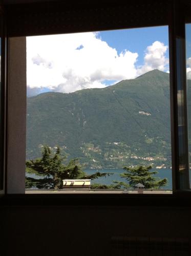 a window with a view of a mountain at Lake View Apartments in Acquaseria