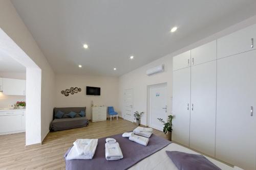 Postel nebo postele na pokoji v ubytování Apart-Hotel Poseidon