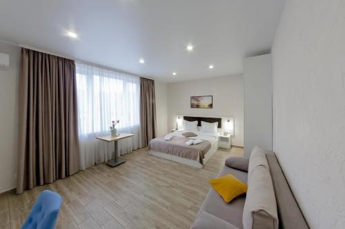 Postel nebo postele na pokoji v ubytování Apart-Hotel Poseidon