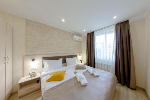 Postel nebo postele na pokoji v ubytování Apart-Hotel Poseidon
