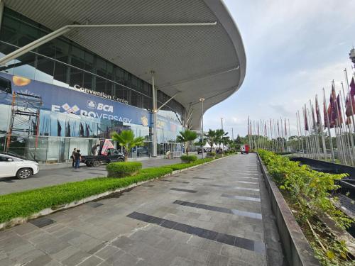 an empty street in front of a building at Apartemen B Residence By LiviRooms BSD CITY in Cilandak