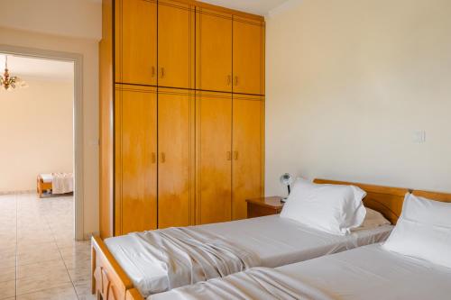 Postel nebo postele na pokoji v ubytování Kallithea Studios & Apartments