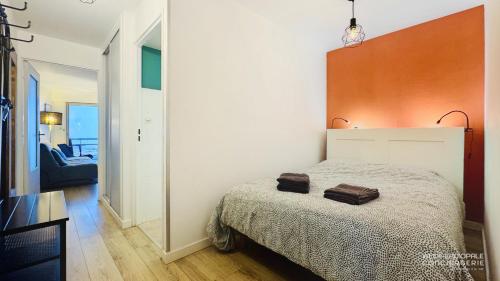 Ένα ή περισσότερα κρεβάτια σε δωμάτιο στο Appartement Vue Mer au pied de la plage de Merlimont