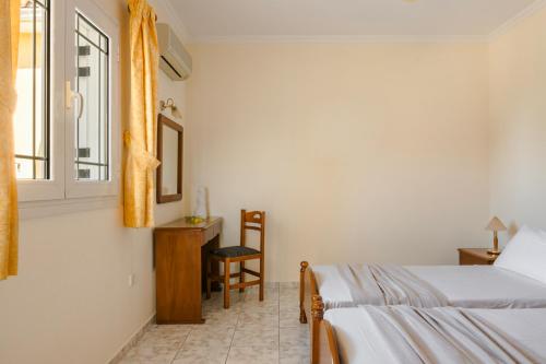 Postel nebo postele na pokoji v ubytování Kallithea Studios & Apartments