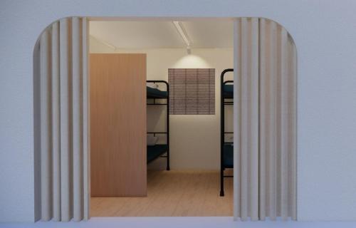 an open door to a room with bunk beds at Zen Seoul Stay in Seoul