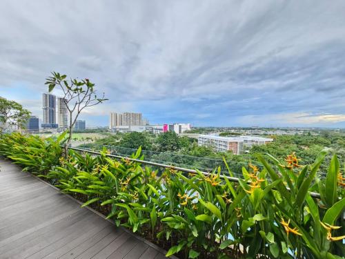 a balcony with plants and a view of the city at Apartemen B Residence By LiviRooms BSD CITY in Cilandak