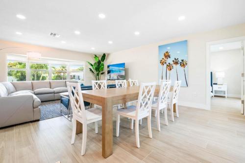 a dining room with a table and chairs at 4 BD 3BA Heated Pool Close to Beach in Boca Raton