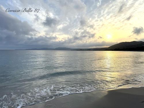 a view of a body of water with a cloudy sky at Corsica Bella 87 T2 Cosy piscines proche plage in Lecci