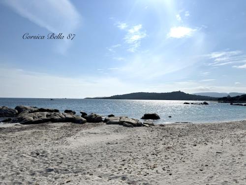 a group of rocks on a beach near the water at Corsica Bella 87 T2 Cosy piscines proche plage in Lecci