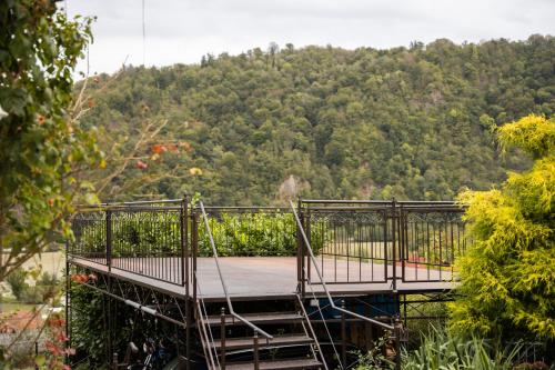 a suspension bridge with a mountain in the background at Bed and Breakfast Petra Huber in Vichtenstein