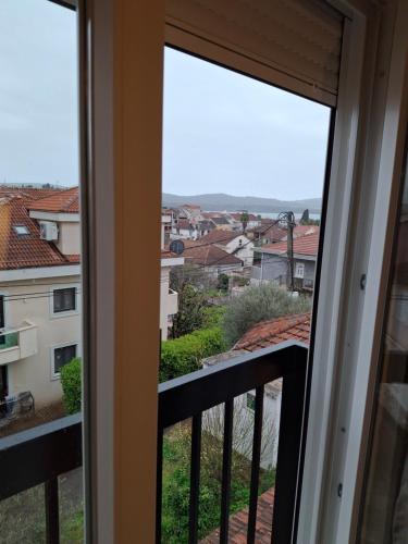 a balcony with a view of a city at House 23 B2 in Tivat