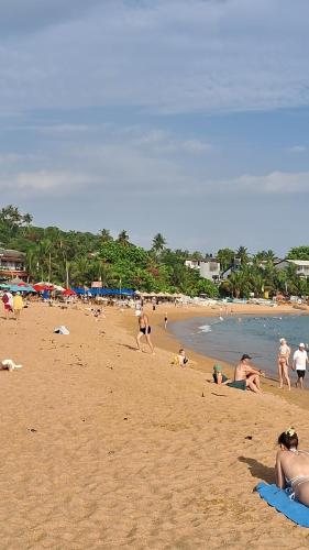 a group of people laying on a beach at RKO Villa27 - Unawatuna in Habaraduwa