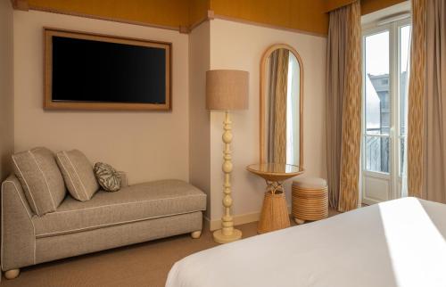 Кровать или кровати в номере Hôtel Le Soleia by Inwood Hotels