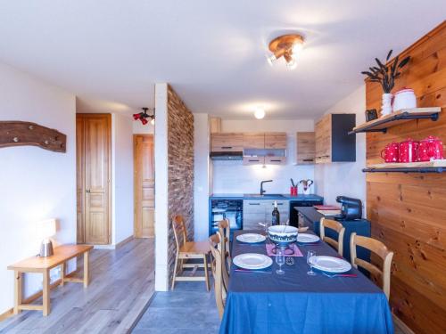 a kitchen and dining room with a table and chairs at Apartment Villars Vacances 20 by Interhome in Villars-sur-Ollon