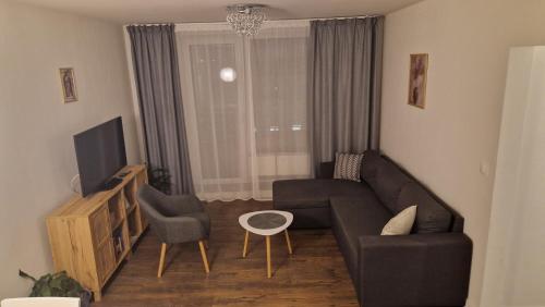 Телевизор и/или развлекательный центр в Horvi Apartment