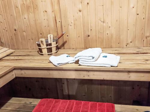 a sauna with towels on a wooden table at Holiday Home Ixi by Interhome in Extertal