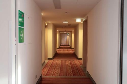 a corridor of a hallway with a long aisle at Park Inn by Radisson Linz in Linz