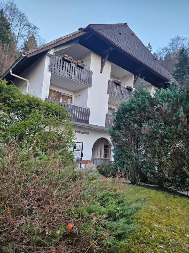 a large white house with a balcony at Triberg Falls Hideaway - Apartment 35 in Triberg