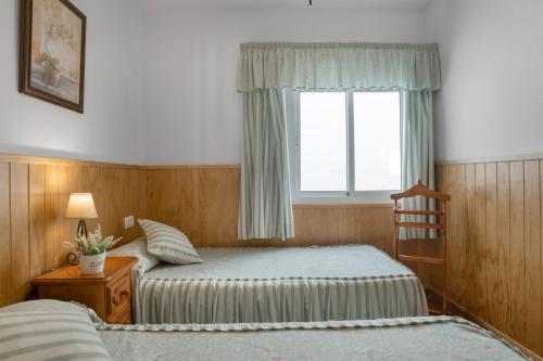 Postel nebo postele na pokoji v ubytování Apartamento Rocio - solo familias