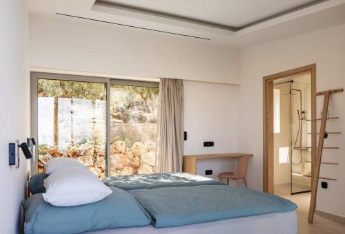 Ένα ή περισσότερα κρεβάτια σε δωμάτιο στο Villas Alisseos