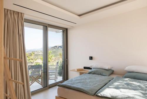 Ένα ή περισσότερα κρεβάτια σε δωμάτιο στο Villas Alisseos