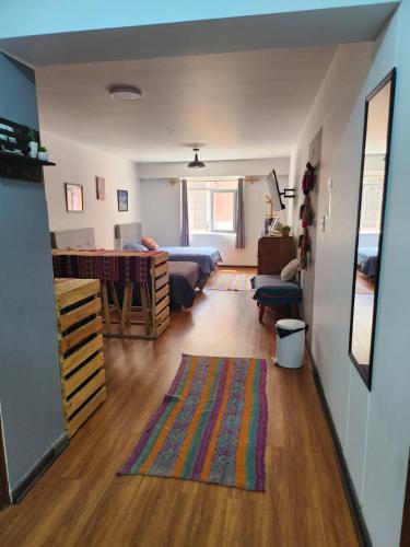 a living room with a couch and a table at Alojamiento San Francisco - Apartamentos y habitaciones in Lima