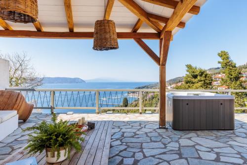 an outdoor patio with a view of the ocean at Archodiko at Palio Klima in Neo Klima