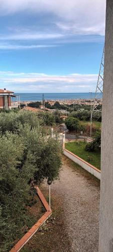 a walkway with a view of a city at Villa Cristina in Boissano