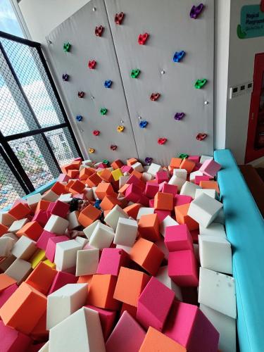 a room filled with lots of pink and white boxes at A La Carte Ha Long Oceanview Fireworksview 2BR2WC suite with balcony in Ha Long