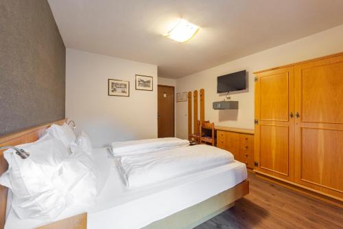 Postel nebo postele na pokoji v ubytování Hotel Stella