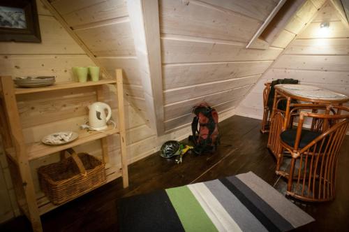 a room with a table and chairs in a cabin at Legenda Tatr in Zakopane