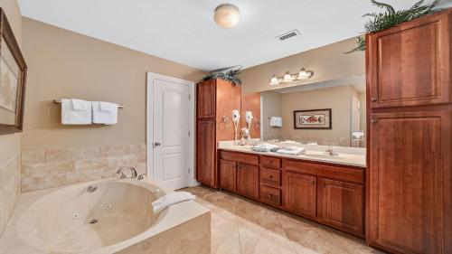 a large bathroom with a tub and a sink at The Oasis at Orange Beach 1002 (Phoenix West II) in Orange Beach