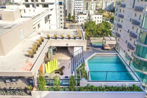 an aerial view of a building with a swimming pool at Breakfast included Regatta living II 404 in Los Prados