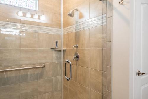 a bathroom with a shower with a glass door at Heated Pool 4BR Retreat Family Friendly in Carlton