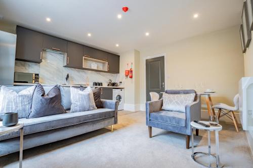 a living room with a couch and two chairs at WhiskAwayHomes - Shaw Street - Apartment 8 in Worcester